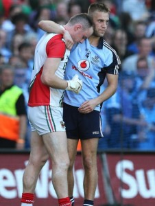 jonny-cooper-consoles-robert-hennelly-after-the-game-2292013-3-390x516